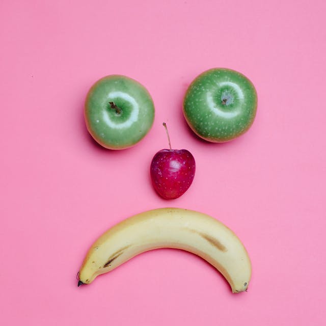 A photo of fruit shaped in a sad face