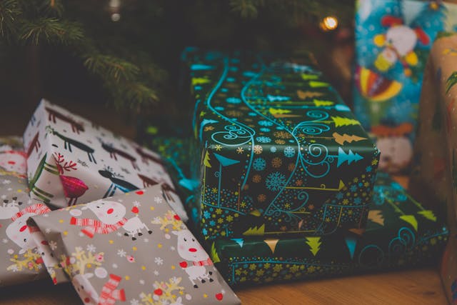 A box of Christmas gifts under a tree