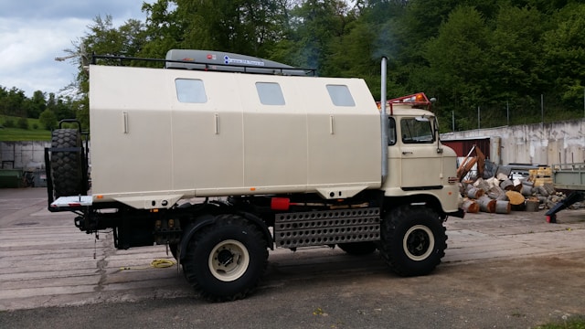 An armored money truck driving down the road