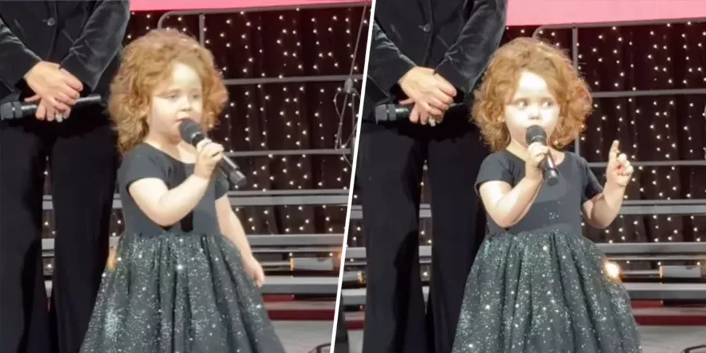 Little girl holding a microphone