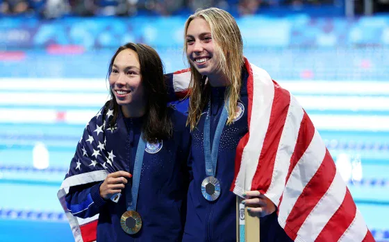 2 Swimmers hugging at the olympics
